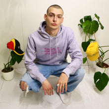 Load image into Gallery viewer, Trendy lavender hoodie with Manifest x Friends of Montys embroidery, combining comfort and unique design.