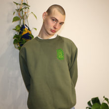 Load image into Gallery viewer, Premium green heavyweight sweatshirt showcasing Manifest x Friends of Montys embroidery for a unique, standout look.