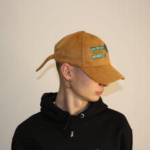 Load image into Gallery viewer, Stylish brown suede embroidered cap with 'Love Where You Live' design by Manifest, perfect for everyday wear.