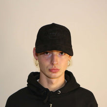 Load image into Gallery viewer, Black suede cap from Manifest with detailed embroidery, offering a sleek and stylish accessory.