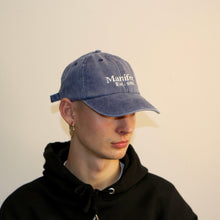 Load image into Gallery viewer, Stylish dusty denim cap from Manifest featuring intricate embroidery, perfect for casual, everyday wear.