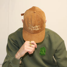 Load image into Gallery viewer, Limited edition brown cord cap with embroidered Manifest x Friends of Montys logo, perfect for collectors.
