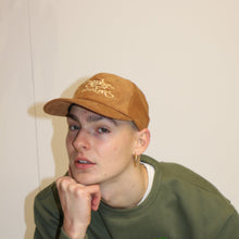 Load image into Gallery viewer, Unique brown cord cap featuring the iconic Manifest x Friends of Montys embroidery for a casual, stylish look