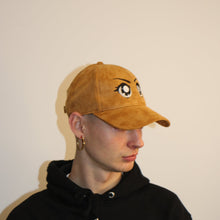 Load image into Gallery viewer, Suede brown embroidered cap with anime-inspired eyes design, perfect for anime fans and streetwear lovers
