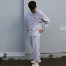 Load image into Gallery viewer, Manifest grey embroidered jogger pants made from soft cotton, combining comfort with a modern design.