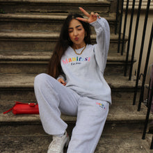 Load image into Gallery viewer, Stylish grey sweatshirt with vibrant Manifest Pride embroidery, showcasing a bold and colorful statement.