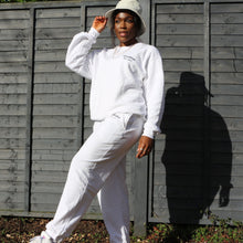 Load image into Gallery viewer, Casual white cotton joggers from Manifest, ideal for a laid-back, fashion-forward embroidered