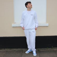 Load image into Gallery viewer, Manifest white cotton joggers with a smooth fit, combining simplicity and comfort in one stylish piece.