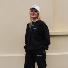 Load image into Gallery viewer, Black sweatshirt from Manifest featuring detailed embroidery, offering a sleek and stylish look.