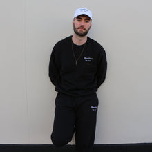 Load image into Gallery viewer, Stylish black embroidered sweatshirt by Manifest, combining simplicity and modern design.