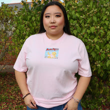 Load image into Gallery viewer, Person wearing a pink t-shirt with a cat graphic design in an outdoor setting
